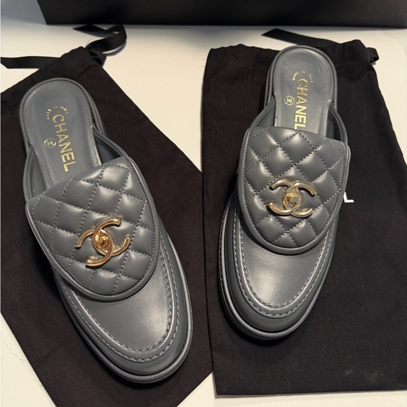 CHANEL Shoes - CHANEL Gray Quilted Mules with Gold Logo